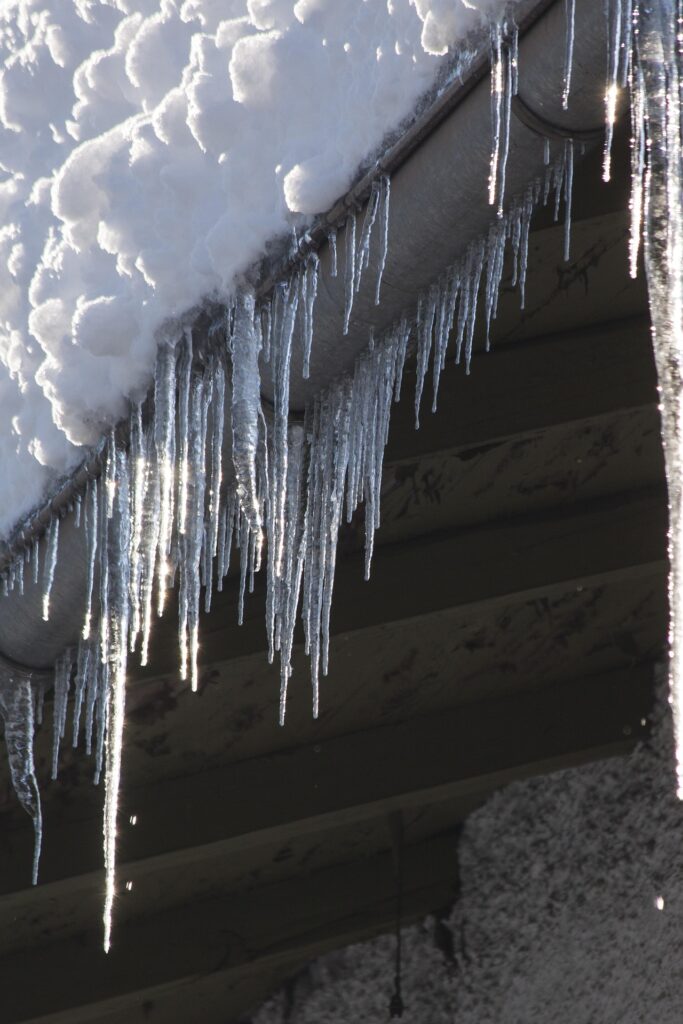 Ice-dam and icicles on rain gutters in Maine